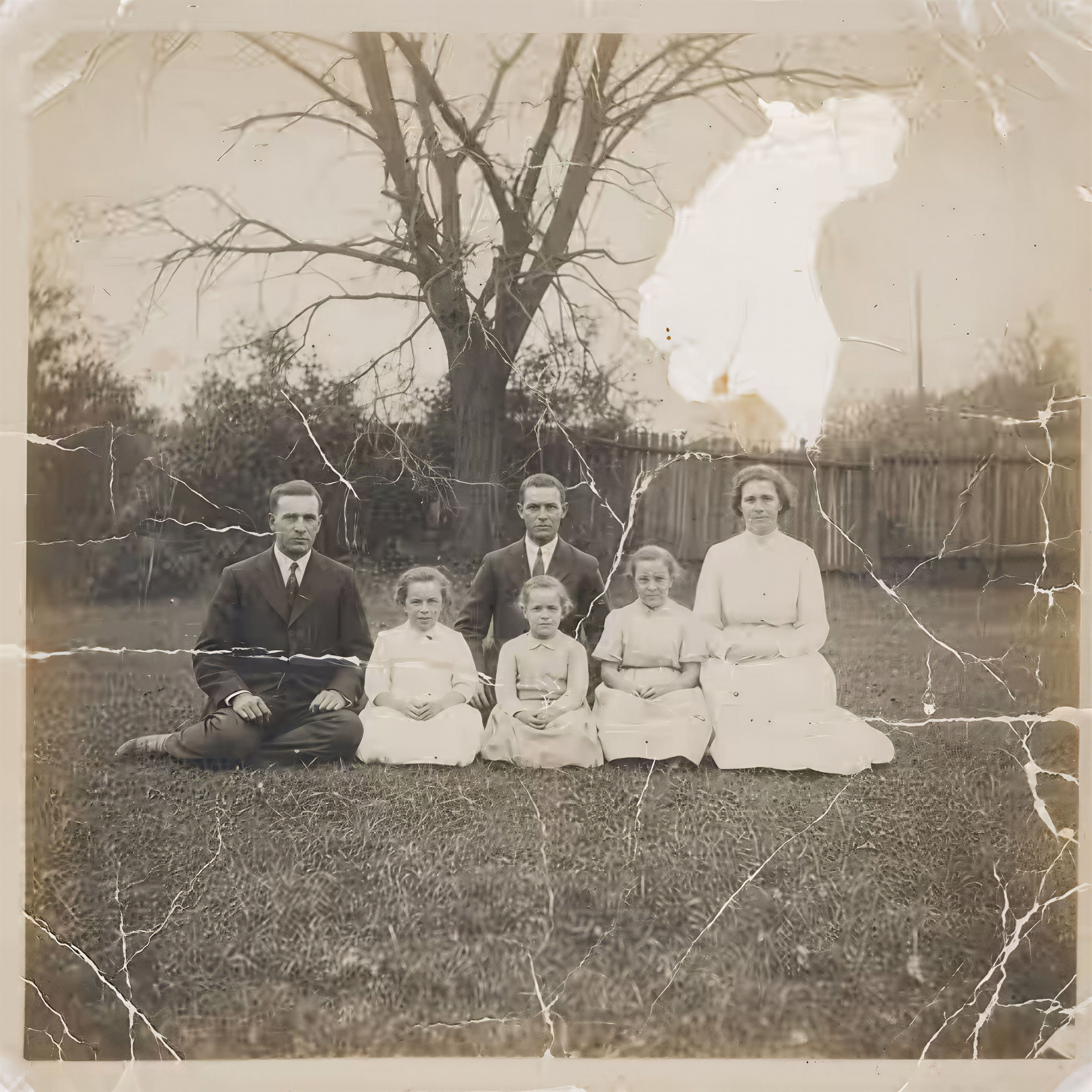 A torn and creased old photo